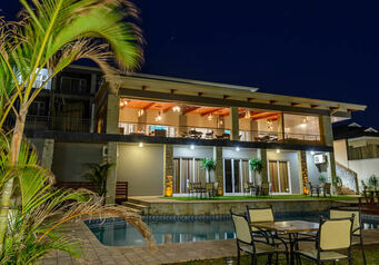 Umthunzi hotel at night showing the pool and patio